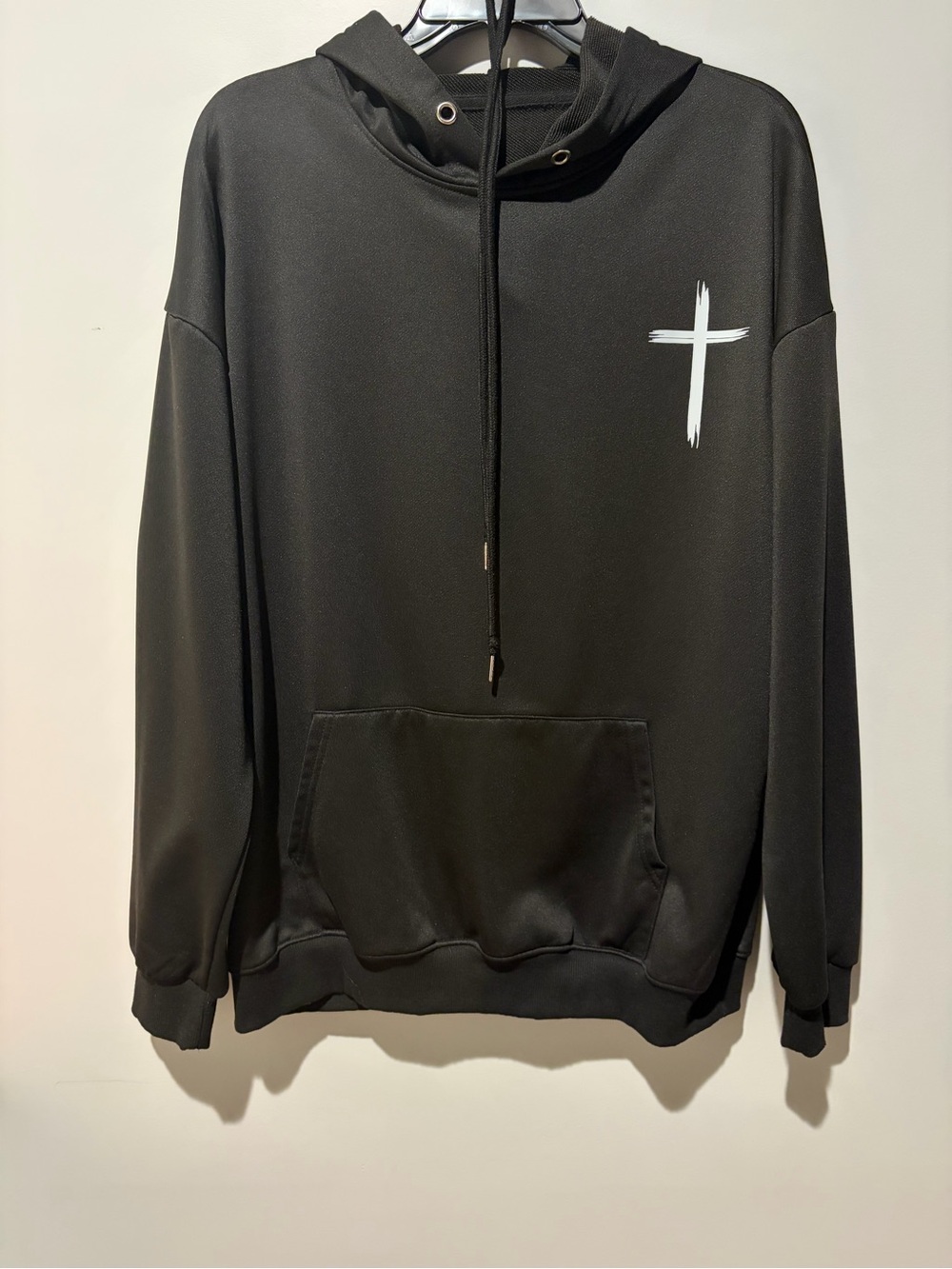 Source Unknown Black Hoodie with White Cross Graphic